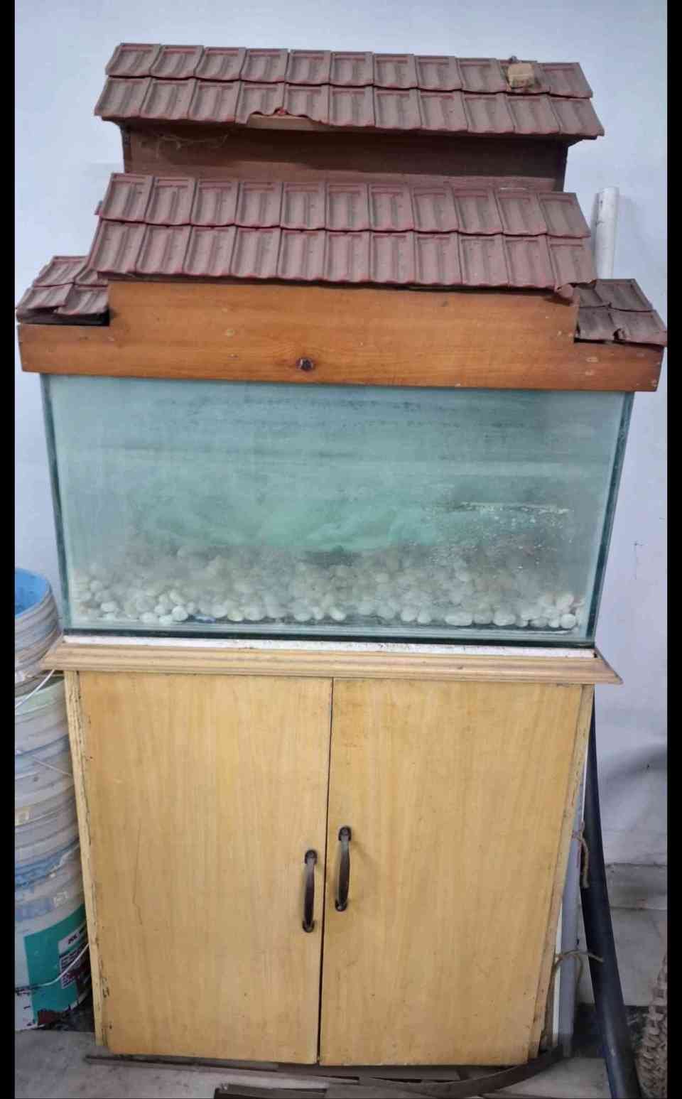 fish tank along with tank top and table